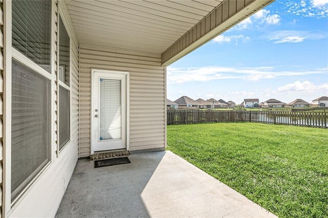 728 Lakeshore Village Dr, Slidell, LA 70461 - view of exterior entry featuring a water view, a patio, and a residential view