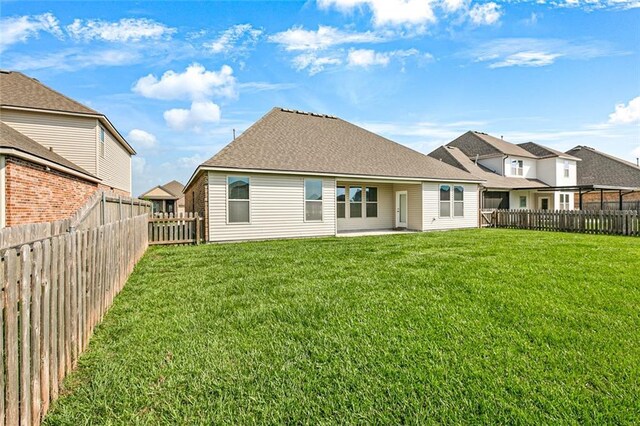 728 Lakeshore Village Dr, Slidell, LA 70461 - rear view of property with a shingled roof