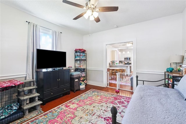 220 Moss Ln, River Ridge, LA 70123 - bedroom featuring wood finished floors, ceiling fan, and baseboards