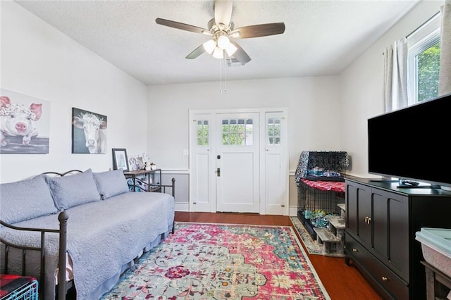 220 Moss Ln, River Ridge, LA 70123 - living room featuring wood finished floors, ceiling fan, and a textured ceiling