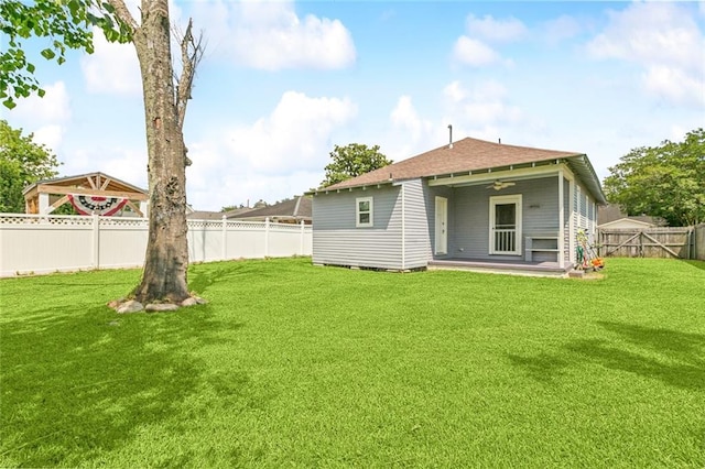 220 Moss Ln, River Ridge, LA 70123 - rear view of property featuring a shingled roof, ceiling fan, and a patio