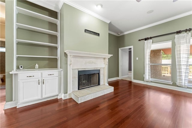118 Windward Passage St, Slidell, LA 70458 - unfurnished living room with dark wood-style flooring, ornamental molding, a tile fireplace, and baseboards
