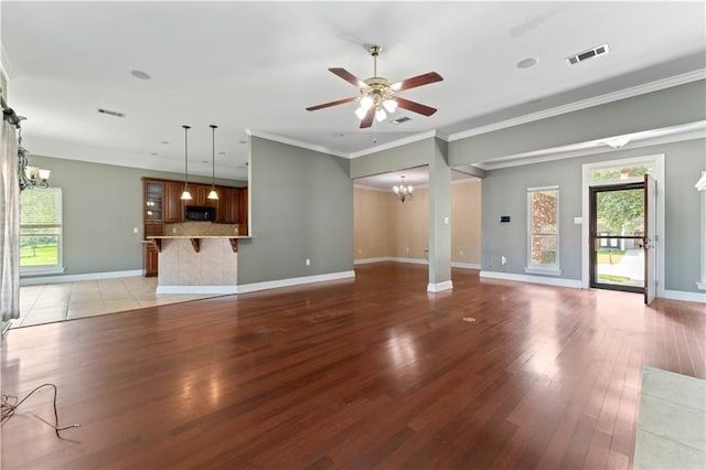 118 Windward Passage St, Slidell, LA 70458 - unfurnished living room with a chandelier, light wood-style floors, a ceiling fan, baseboards, and ornamental molding
