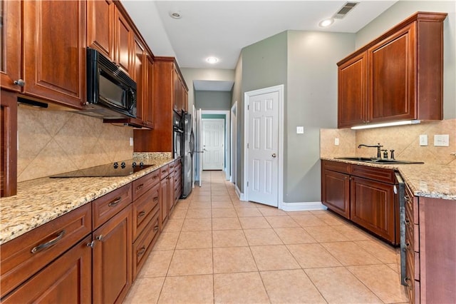 118 Windward Passage St, Slidell, LA 70458 - kitchen featuring black appliances, a sink, baseboards, light stone countertops, and tasteful backsplash