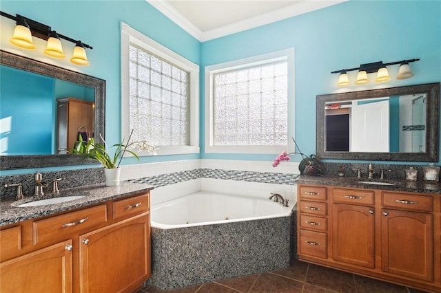 422 Kensington Blvd, Slidell, LA 70458 - full bathroom with two vanities, crown molding, a whirlpool tub, and tile patterned floors