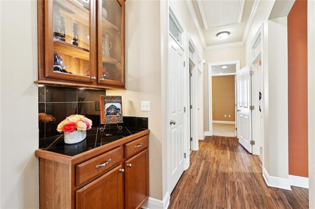 422 Kensington Blvd, Slidell, LA 70458 - hallway featuring ornamental molding, dark wood-style floors, attic access, and baseboards