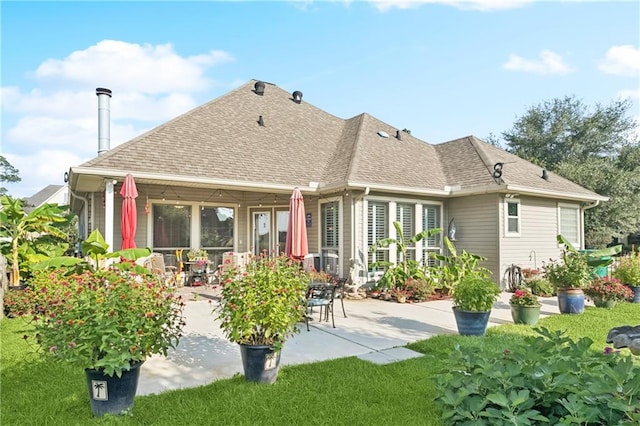 422 Kensington Blvd, Slidell, LA 70458 - rear view of property featuring a patio, roof with shingles, and a yard
