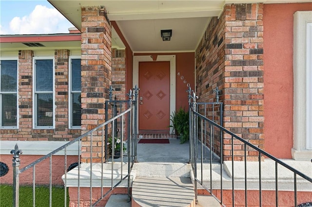 4060 S Windmere St, Harvey, LA 70058 - doorway to property featuring brick siding