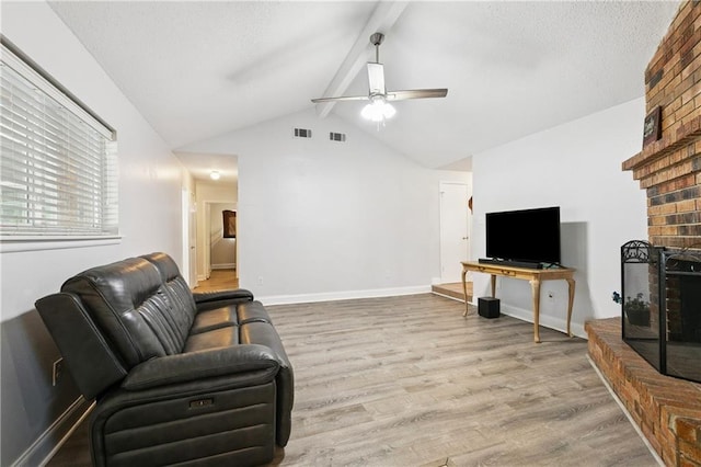 4060 S Windmere St, Harvey, LA 70058 - living room featuring a brick fireplace, wood finished floors, a ceiling fan, and baseboards