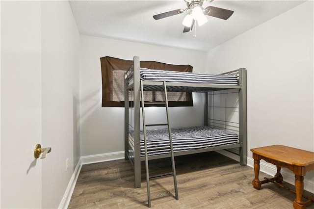 4060 S Windmere St, Harvey, LA 70058 - bedroom with wood finished floors, baseboards, and ceiling fan