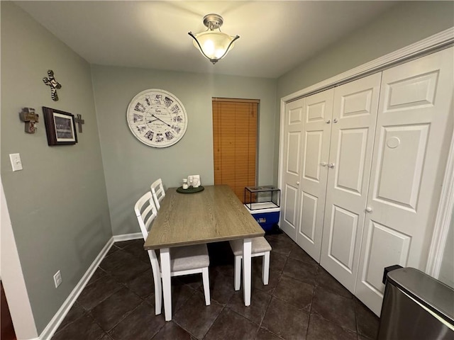 6035-37 Colbert St, New Orleans, LA 70124 - dining room with dark tile patterned floors and baseboards