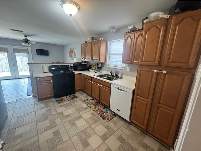 6035-37 Colbert St, New Orleans, LA 70124 - kitchen with black appliances, a sink, light countertops, ceiling fan, and a peninsula