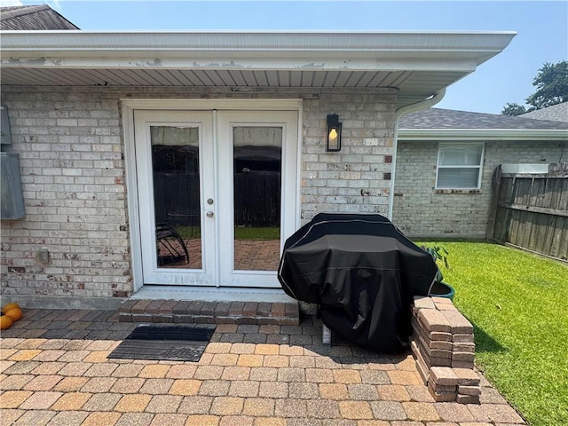6035-37 Colbert St, New Orleans, LA 70124 - entrance to property featuring french doors, brick siding, and a shingled roof