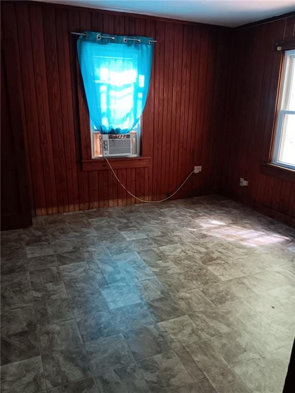 802 Varnado St, Franklinton, LA 70438 - unfurnished room featuring cooling unit, wood walls, and tile patterned floors