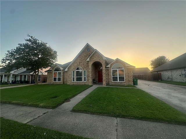 2227 Pine Valley Dr, La Place, LA 70068 - ranch-style home with a front lawn, brick siding, and driveway