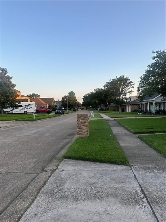 2227 Pine Valley Dr, La Place, LA 70068 - view of asphalt road featuring sidewalks