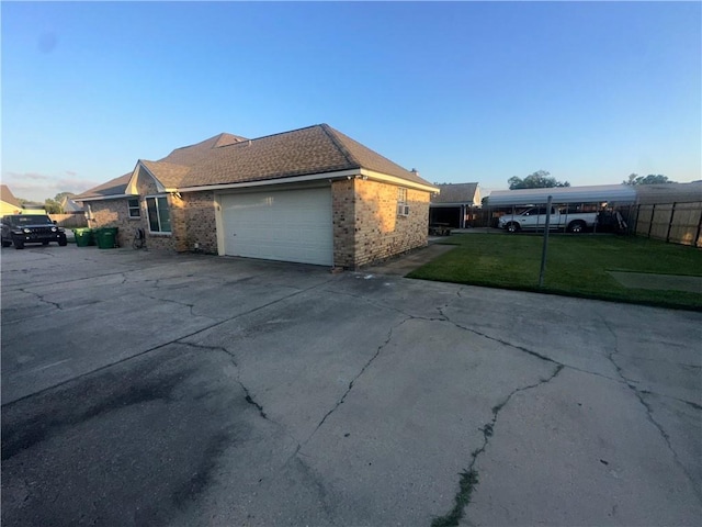 2227 Pine Valley Dr, La Place, LA 70068 - view of property exterior with a garage, driveway, and brick siding