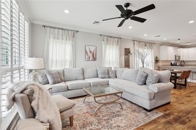 139 Abita Oaks Loop, Abita Springs, LA 70420 - living area featuring ornamental molding, recessed lighting, wood finished floors, and a ceiling fan