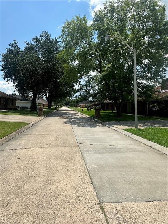 131 Belle Grove Dr, La Place, LA 70068 - view of concrete road with curbs