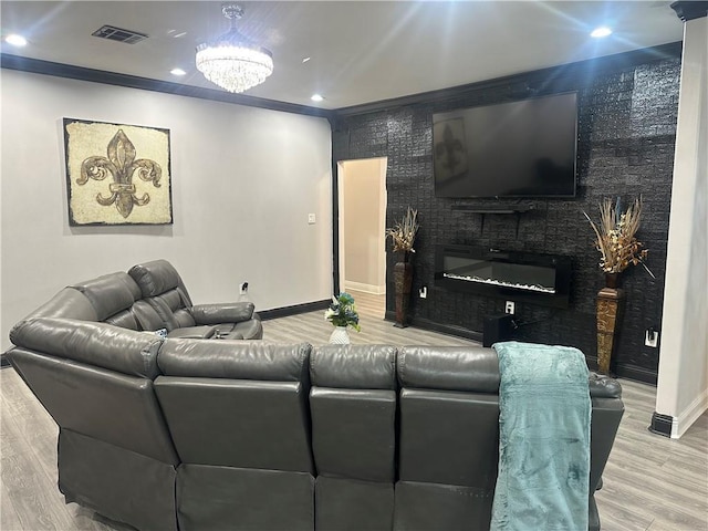 131 Belle Grove Dr, La Place, LA 70068 - living room featuring wood finished floors, a glass covered fireplace, and recessed lighting
