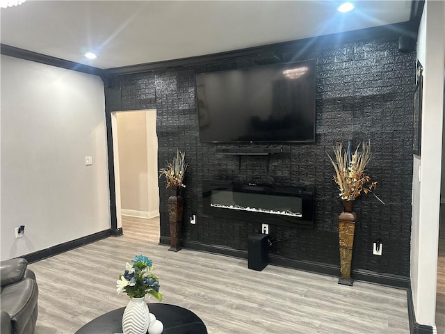 131 Belle Grove Dr, La Place, LA 70068 - living room featuring wood finished floors, a glass covered fireplace, and recessed lighting