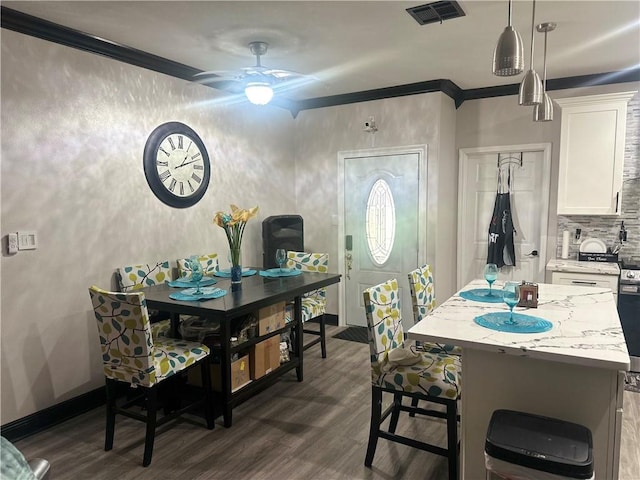 131 Belle Grove Dr, La Place, LA 70068 - dining room featuring dark wood finished floors, ceiling fan, and ornamental molding