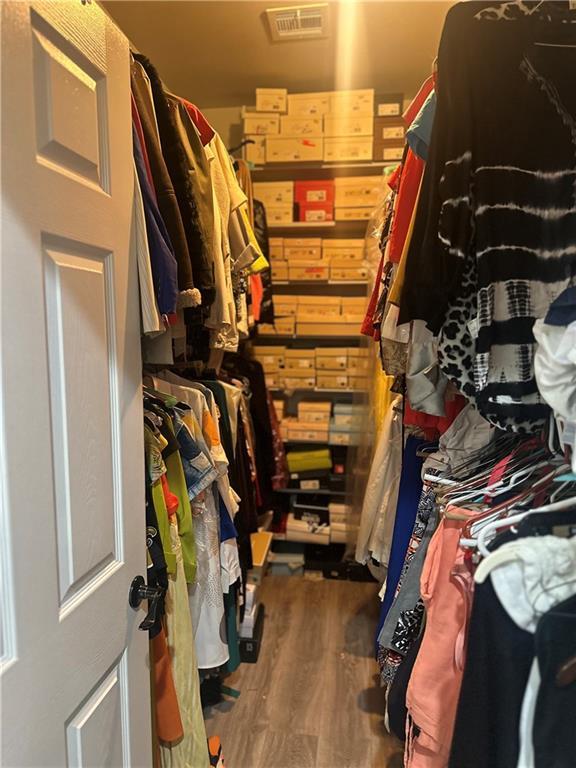 131 Belle Grove Dr, La Place, LA 70068 - walk in closet with wood finished floors
