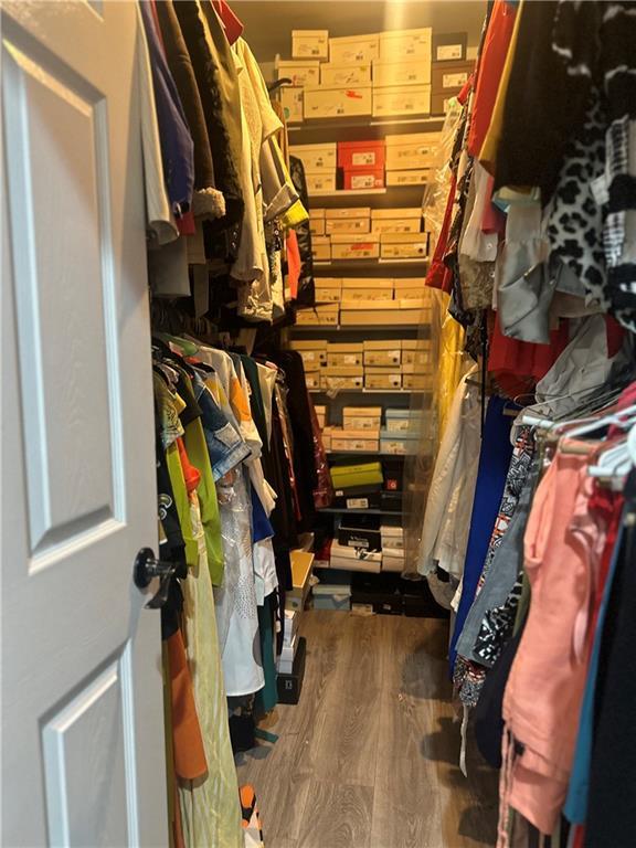 131 Belle Grove Dr, La Place, LA 70068 - walk in closet featuring wood finished floors
