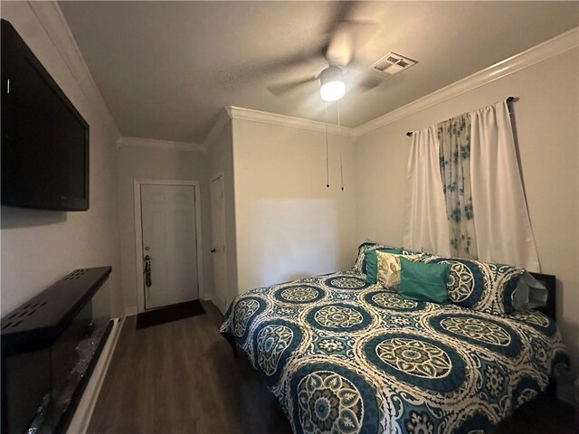 131 Belle Grove Dr, La Place, LA 70068 - bedroom featuring dark wood-type flooring, ornamental molding, and a ceiling fan