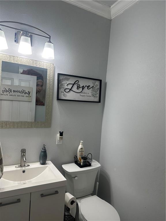 131 Belle Grove Dr, La Place, LA 70068 - bathroom with ornamental molding and vanity