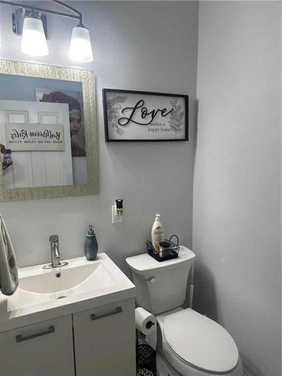 131 Belle Grove Dr, La Place, LA 70068 - half bathroom featuring toilet and vanity