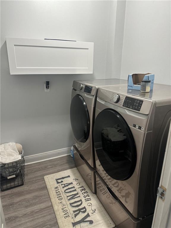 131 Belle Grove Dr, La Place, LA 70068 - laundry room with washing machine and clothes dryer and light wood-type flooring