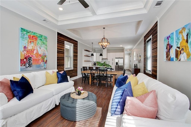 637 S Dupre St, New Orleans, LA 70119 - living area with dark wood-style floors, ceiling fan, crown molding, a chandelier, and baseboards