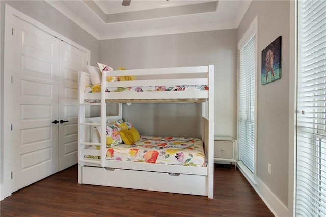 637 S Dupre St, New Orleans, LA 70119 - bedroom featuring wood finished floors and a tray ceiling