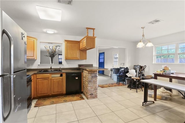 709 Fielding Ave, Gretna, LA 70056 - kitchen with dishwasher, freestanding refrigerator, a sink, dark countertops, and light tile patterned floors