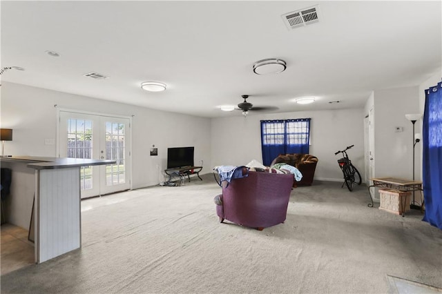 709 Fielding Ave, Gretna, LA 70056 - living area featuring healthy amount of natural light, french doors, a ceiling fan, and light carpet