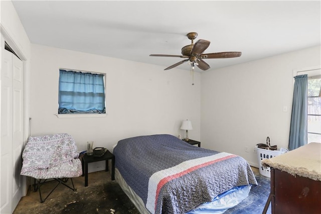 709 Fielding Ave, Gretna, LA 70056 - bedroom with ceiling fan, a closet, and unfinished concrete floors