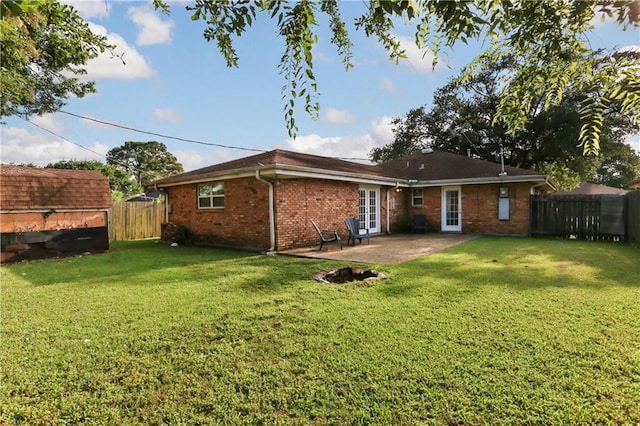 709 Fielding Ave, Gretna, LA 70056 - back of house featuring french doors, brick siding, and a patio area