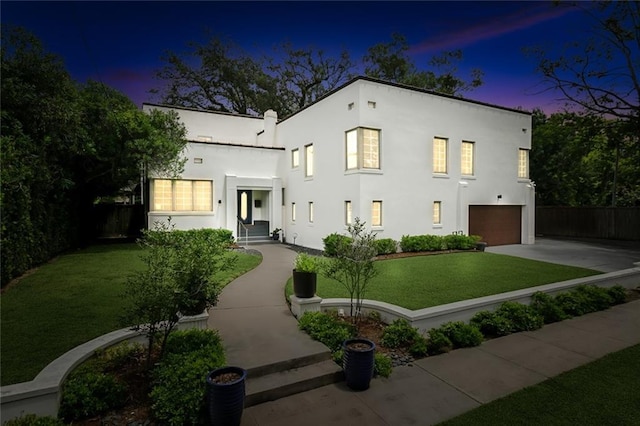 3 Fairview Ct, Metairie, LA 70005 - view of front of house featuring a garage, concrete driveway, and stucco siding