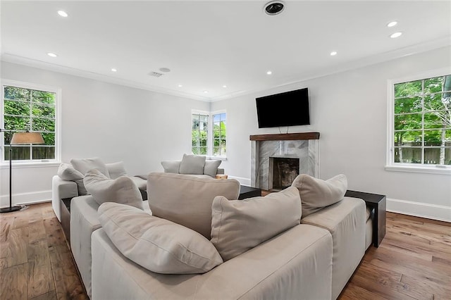 3 Fairview Ct, Metairie, LA 70005 - living room featuring baseboards, wood finished floors, a fireplace, recessed lighting, and crown molding