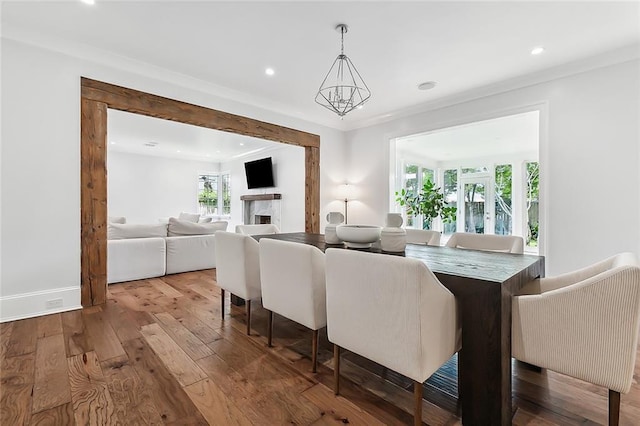 3 Fairview Ct, Metairie, LA 70005 - living room featuring wood-type flooring, recessed lighting, ornamental molding, baseboards, and a chandelier