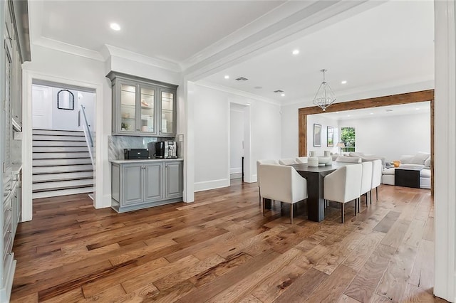 3 Fairview Ct, Metairie, LA 70005 - dining area featuring light wood-style flooring, stairway, recessed lighting, crown molding, and a chandelier
