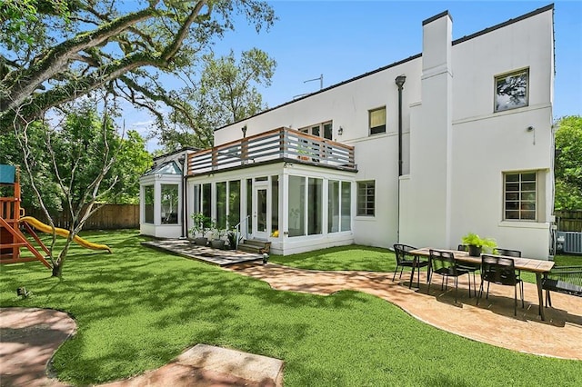 3 Fairview Ct, Metairie, LA 70005 - rear view of house with a balcony, a patio area, stucco siding, and a sunroom