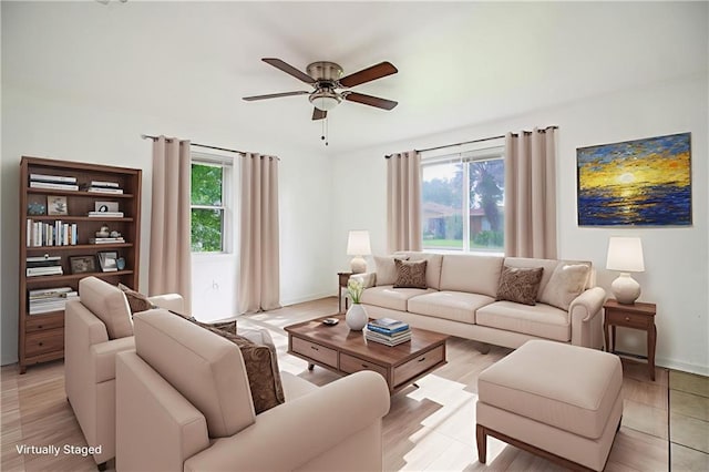 208 Magnolia Ave, La Place, LA 70068 - living area featuring a ceiling fan and baseboards