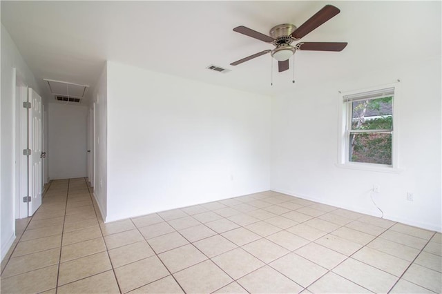208 Magnolia Ave, La Place, LA 70068 - spare room with attic access, a ceiling fan, and light tile patterned floors