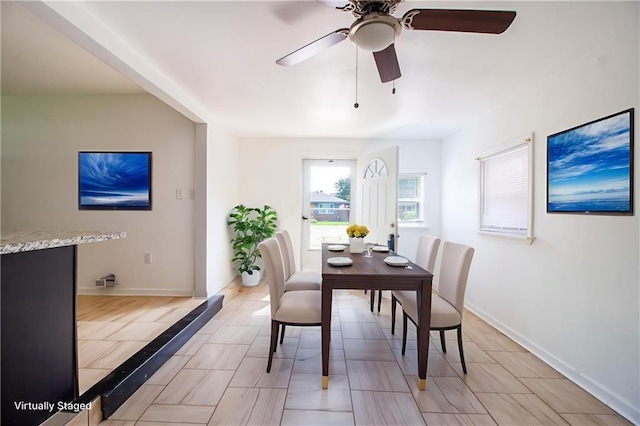 208 Magnolia Ave, La Place, LA 70068 - dining room featuring a ceiling fan and baseboards
