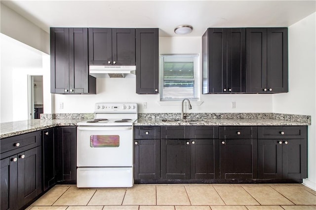 208 Magnolia Ave, La Place, LA 70068 - kitchen with white electric range oven, under cabinet range hood, a sink, light stone counters, and light tile patterned floors