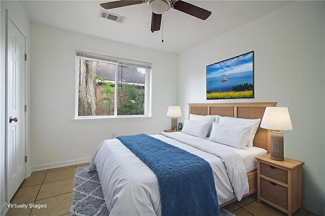 208 Magnolia Ave, La Place, LA 70068 - tiled bedroom with baseboards and a ceiling fan
