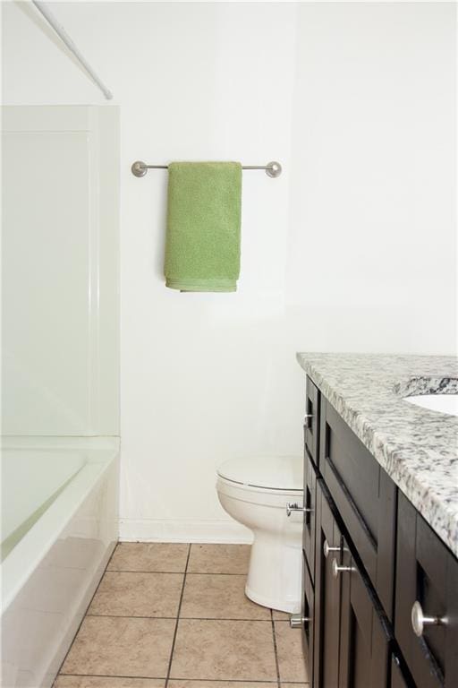 208 Magnolia Ave, La Place, LA 70068 - bathroom with vanity, toilet, tile patterned floors, and baseboards