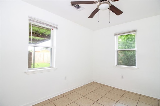 208 Magnolia Ave, La Place, LA 70068 - spare room with baseboards, light tile patterned floors, and a ceiling fan